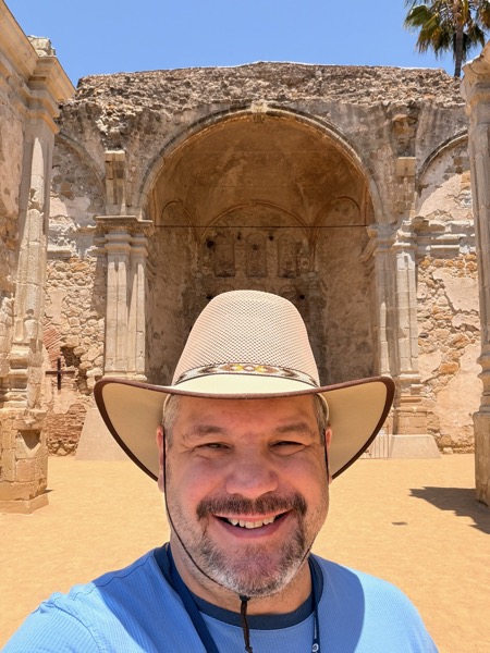 Jeffrey, the author of First Mass, standing at the ruins of Mission San Juan Capistrano